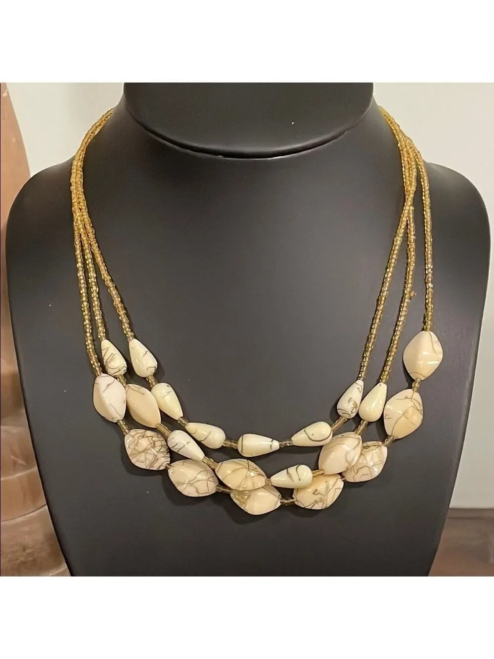 Vintage triple strand gold seed bead and ivory swirl beaded necklace